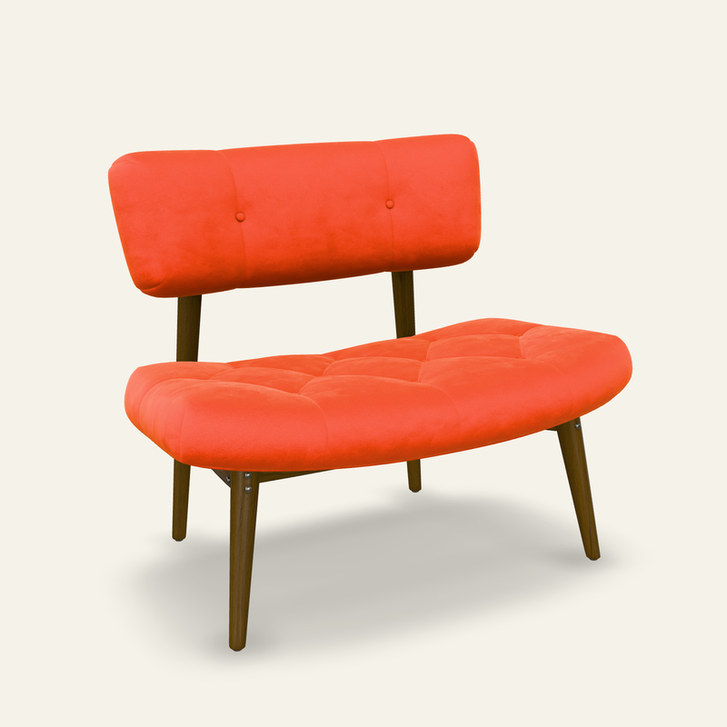 Mango velvet lounge chair with curved upholstery and a dark metal frame